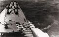 Носовая трёхорудийная башня МК-5-бис крейсера пр.68-бис ведёт стрельбу.