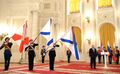 Корабельные флаги ракетного крейсера «Варяг» и ТАКР «Адмирал флота Советского Союза Кузнецов» после награждения орденами в на церемонии в Кремле 23 февраля 2018 года