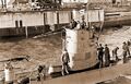 Подводная лодка U-9 под командованием Вольфганга Люта в Вильгельмсхафене 15 мая 1940 года. Любопытна форма эмблемы на рубке – видимо, крест снят и видно только основание его крепления.