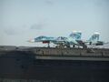 Дежурная пара Су-33 (борт.№№ красные 88 и 61) с ракетами Р-27 и Р-73 на стартовых позициях ТАКР «Адмирал Кузнецов». Средиземное море, зима 2007/2008 года