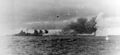Немецкий линкор Bismarck ведет огонь по HMS Prince of Wales и HMS Hood во время боя в Датском проливе, 24 мая 1941 г.