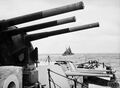 Вид из-под башен ГК крейсера HMS Sheffield на линкор HMS Anson. 1942 год