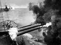 HMS Valiant в колонне с HMS Barham и HMS Warspite ведёт огонь из орудий главного калибра.