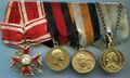 Колодка морского офицера участника Первой мировой войны: орден Св. Станислава 3 ст. с Мечами, медаль «В память 100-летия Отечественной войны», медаль «В память 300-летия царствования дома Романовых» и медаль «В память 200-летия Гангутской победы». Аверс.