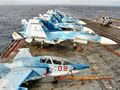 Палубные истребители Су-33 и учебно-тренировочный самолет Су-25 УТГ и десантный вертолет Ка-29 на палубе тяжелого авианесущего крейсера "Адмирал флота Советского Союза Кузнецов" (1985)