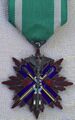 Знак ордена Золотого коршуна IV класса. Аверс.
