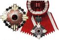 Звезда и знак ордена Восходящего солнца с цветами павлонии на Большой ленте.