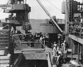 Погрузка 203-мм снарядов в кормовой погреб боезапаса. Январь 1944 г.
