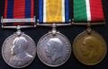 Комплект из трех наград Джона Армора: Транспортная Медаль, Военная Медаль и Медаль торгового флота. Аверс.