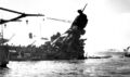 Разрушенная носовая надстройка и фок-мачта линкора USS Arizona, 9 декабря 1941 г. Продолжается тушение пожаров.
