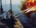 Крейсер USS Saint Paul (CA-73) ведет огонь из орудий главного калибра. Вьетнам.
